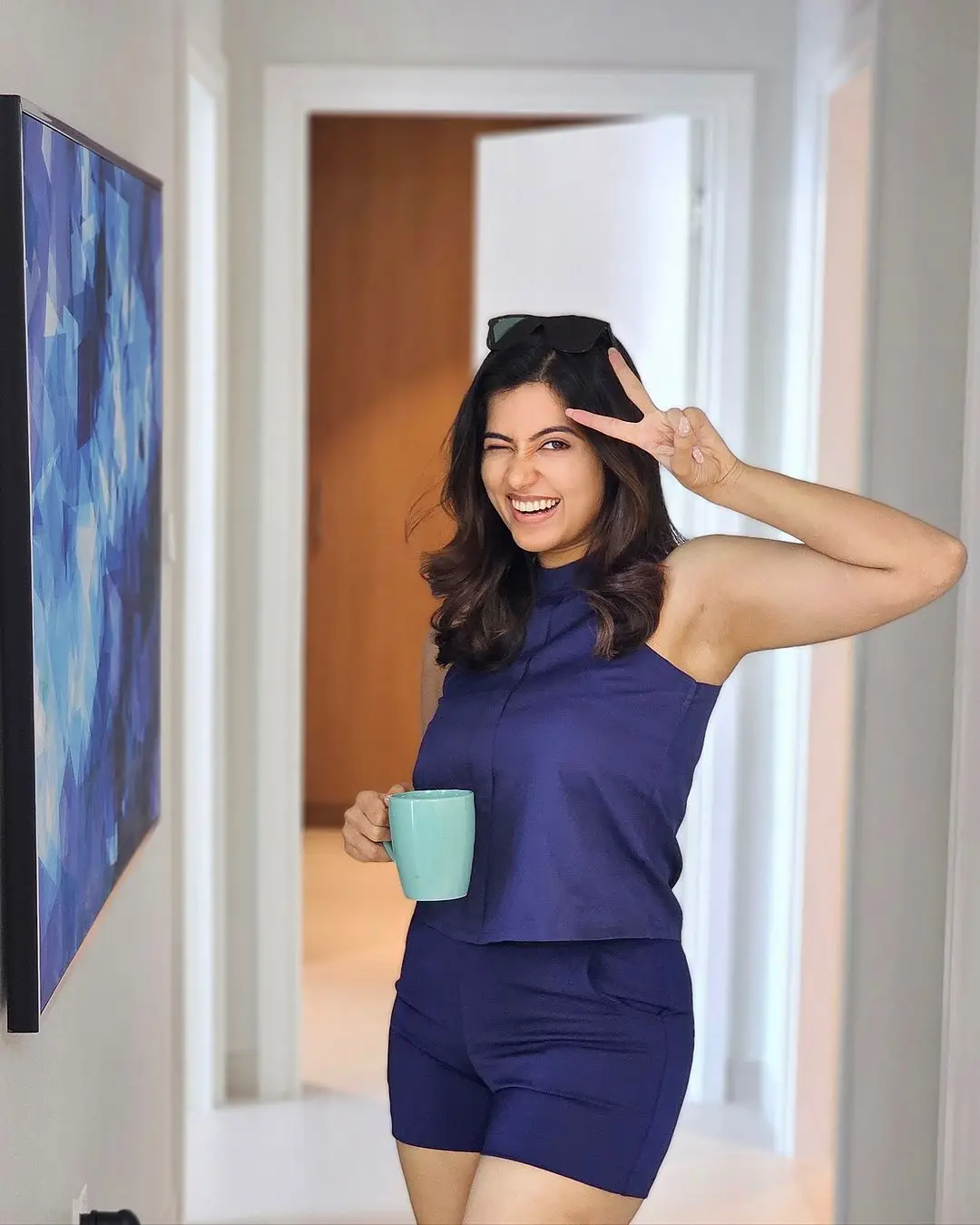 ANJU KURIAN LONG LEGS SHOW IN BLUE SHORT TOP 5